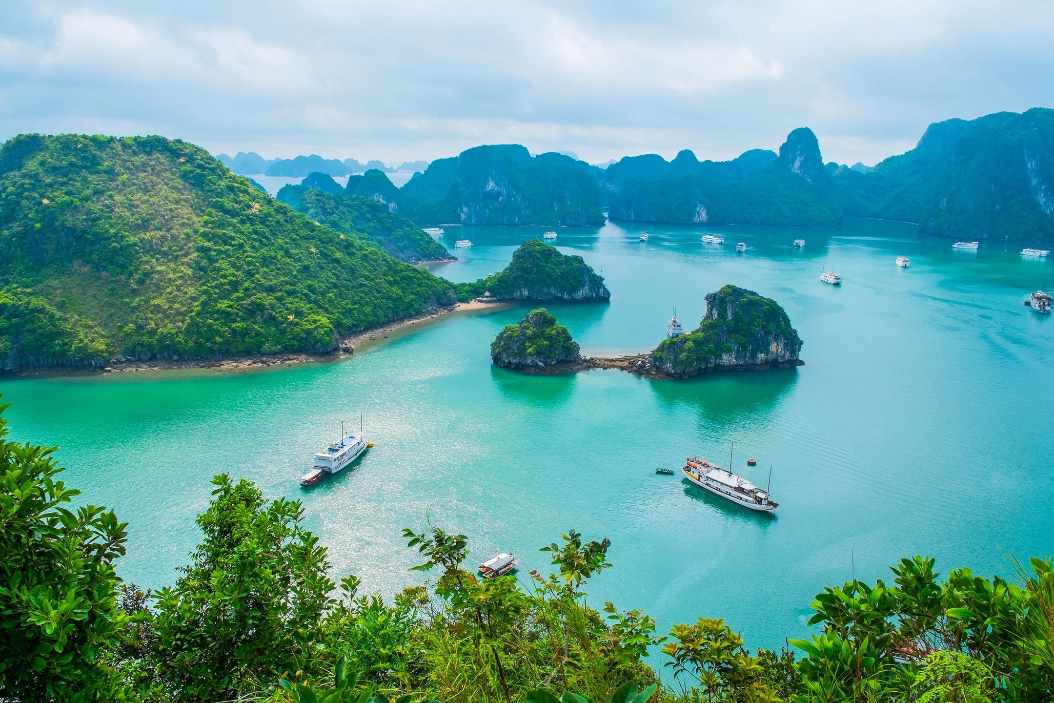 Panoramic view of limestone islands rising from the emerald waters of Halong Bay in Vietnam, Southeast Asia